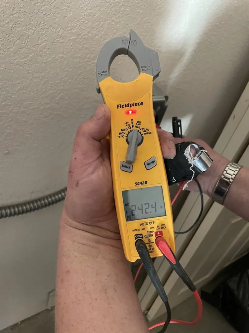 Voltage testing with clamp meter during Recessed Lighting Installation in Media